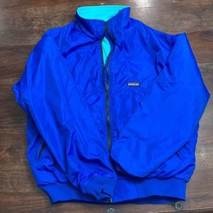 Vintage blue Patagonia jacket.  Blue outside teal inside.   Used.